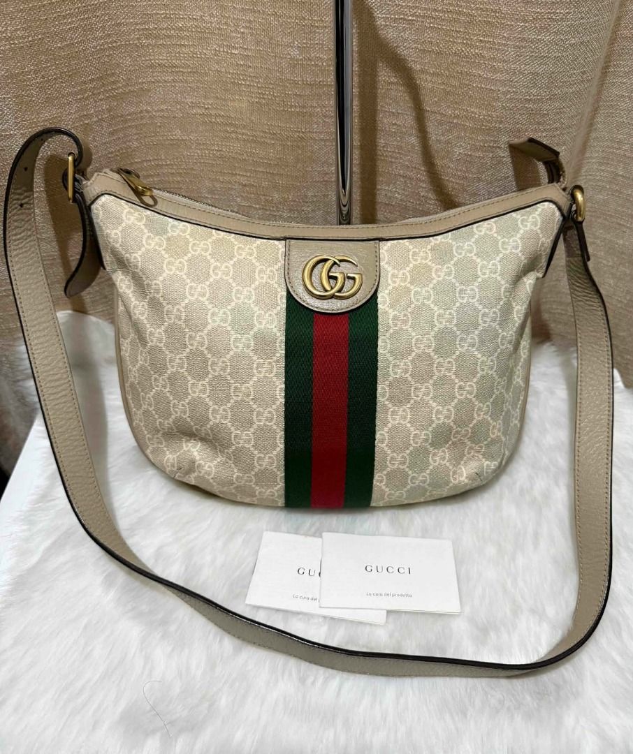 Gucci Ophidia Small Shoulder Bag (Category: Luxury Bags & Wallets) located in Cainta. Submitted by kenpates (Listing ID 1466403768, Image 1). Description: Gucci Ophidia Small Shoulder Bag PHP 33,500 Material: GG Supreme coated canvas with beige/cream grained leather trim and green/red Web stripe Hardware: Antique gold-toned hardware (Double G oval enamel emblem and buckle accents) Strap: Adjustable flat leather shoulder / crossbody strap with buc