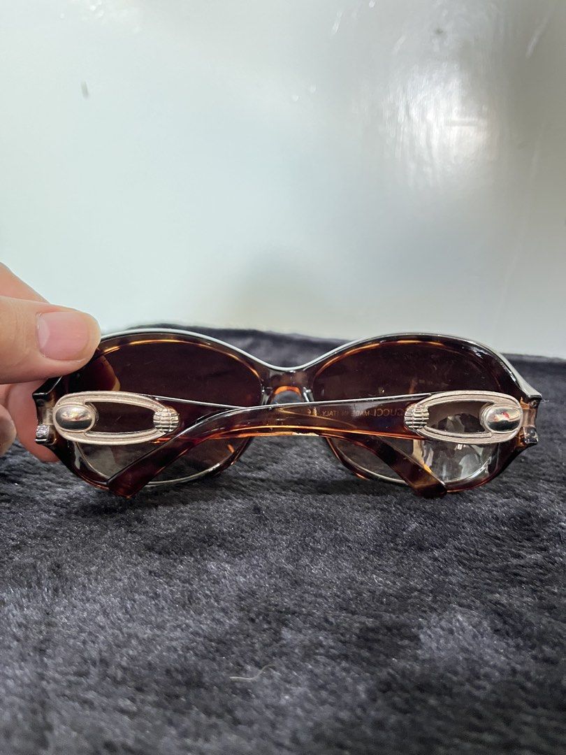 Gucci Tortoiseshell Sunglasses (Category: Sunglasses & Eyewear) located in Baguio. Submitted by arnulfoaz (Listing ID 1466383983, Image 3). Description: Authentic Gucci tortoiseshell sunglasses with brown gradient lenses. Classic oval frames, tortoise print acetate. Distinctive silver metal hardware and logo detailing on the temples. Made in Italy. Normal wear on lenses and frame. - minor scratches - accepting best offers.