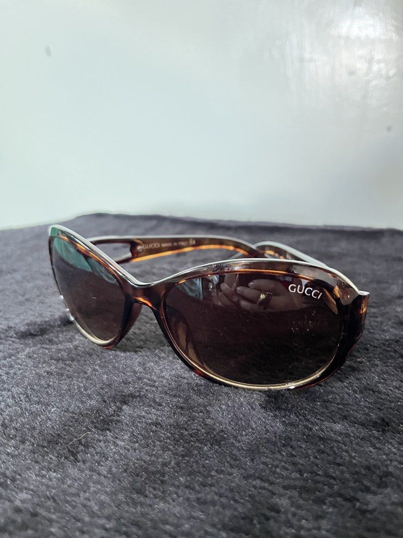 Gucci Tortoiseshell Sunglasses (Category: Sunglasses & Eyewear) located in Baguio. Submitted by arnulfoaz (Listing ID 1466383983, Image 1). Description: Authentic Gucci tortoiseshell sunglasses with brown gradient lenses. Classic oval frames, tortoise print acetate. Distinctive silver metal hardware and logo detailing on the temples. Made in Italy. Normal wear on lenses and frame. - minor scratches - accepting best offers.