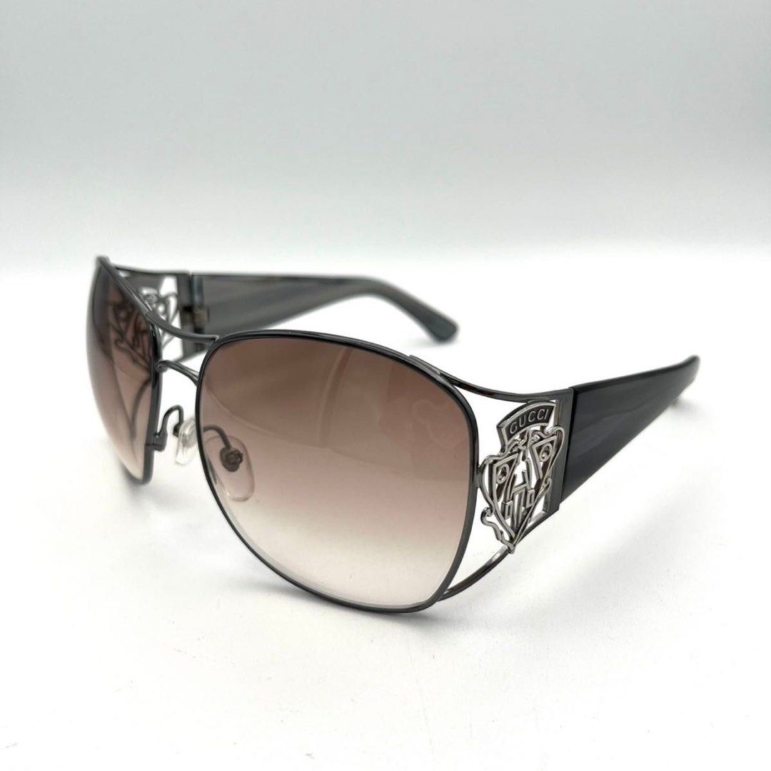 Gucci Sunglasses Y2K Crest Logo (Category: Sunglasses & Eyewear) located in San Jose del Monte. Submitted by declothering_ph (Listing ID 1466441016, Image 1). Description: Item Specifics: Brand: Gucci Model Number: GG2827/S Temple Length: 105mm Country/Region of Manufacture: Italy Product Details: Frame Color: Gunmetal to Dark Tones Lens Color: Brown Gradient Frame Material: Metal Lens Width: ~60mm Bridge Width: ~15mm Temple Length: ~105mm Frame 