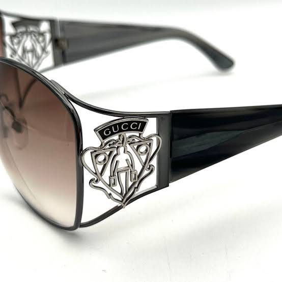 Gucci Sunglasses Y2K Crest Logo (Category: Sunglasses & Eyewear) located in San Jose del Monte. Submitted by declothering_ph (Listing ID 1466441016, Image 2). Description: Item Specifics: Brand: Gucci Model Number: GG2827/S Temple Length: 105mm Country/Region of Manufacture: Italy Product Details: Frame Color: Gunmetal to Dark Tones Lens Color: Brown Gradient Frame Material: Metal Lens Width: ~60mm Bridge Width: ~15mm Temple Length: ~105mm Frame 