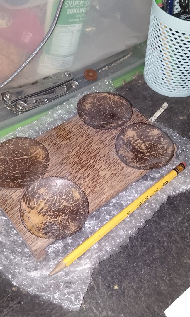 Handcrafted Coconut Shell Appetizer Platter/Home Decor (Category: Handmade Craft) located in Quezon City. Submitted by akosiluna44 (Listing ID 1466549159, Image 3). Description: pre-owned made from polished coconut shells (bao Ng niyog) which are mounted onto a flat plank of rustic palm wood or hardwood Pica-Pica/Appetizer Platter - can be used in tropical or eco-friendly dining setups to serve small finger foods such as peanuts, nuts or candies 