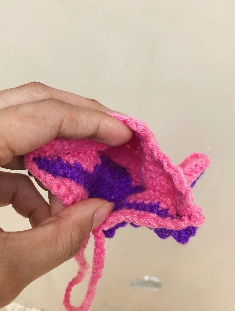 Handmade crochet starfish bag charm (Category: Handmade Craft) located in Quezon City. Submitted by ezrakeith (Listing ID 1466381987, Image 2). Description: - Handmade crochet starfish bag charm - Vibrant pink and purple colorway (can request for other color) - Built-in mini pouch for coins, lipstick, or keys - Convenient loop strap for easy hanging on totes and handbags - Clean and neat stitching all around.