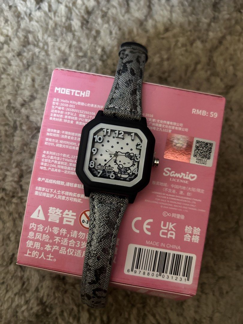 Hello Kitty Leopard Watch Black White (Category: Women's Watches) located in Cavite. Submitted by zacharyyy__ (Listing ID 1466434403, Image 3). Description: - Authentic Sanrio Kitty watch from the Moetch Sweet Heart Leopard series - Stylish black & white dial with star pattern and trendy black square frame - Chic grey animal print strap - Condition: Brand new / Unused (pulled from blind box packaging) - Includes original box with official Sanrio 