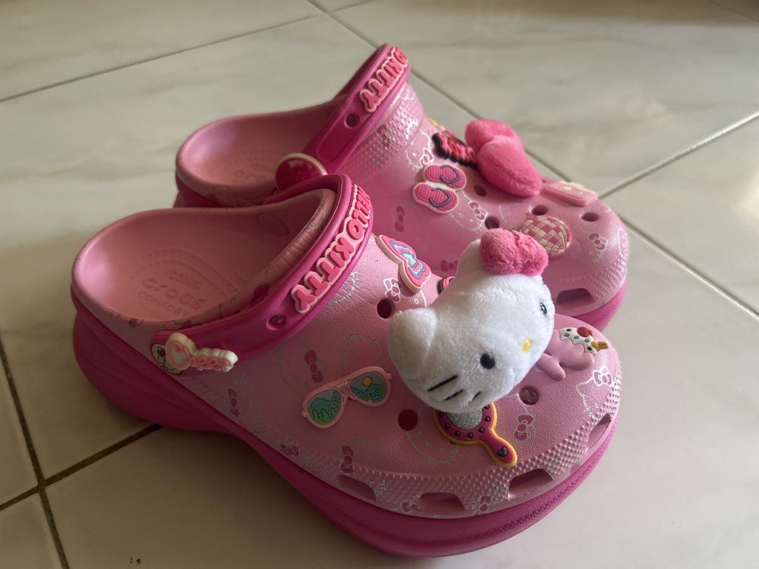Hello Kitty Pink Platform Crocs Clog with Jibbitz (Category: Slippers and slides) located in Roxas City. Submitted by rolarolarolarola (Listing ID 1466377331, Image 1). Description: - OG price: 5000+ including jibbitz, negotiable - Authentic Sanrio Kitty pink platform Crocs - Adorned with fun Jibbitz charms including sunglasses and a hand mirror - Features a large, eye-catching plush Kitty charm on the front - Chunky pink sole offering iconic Cro