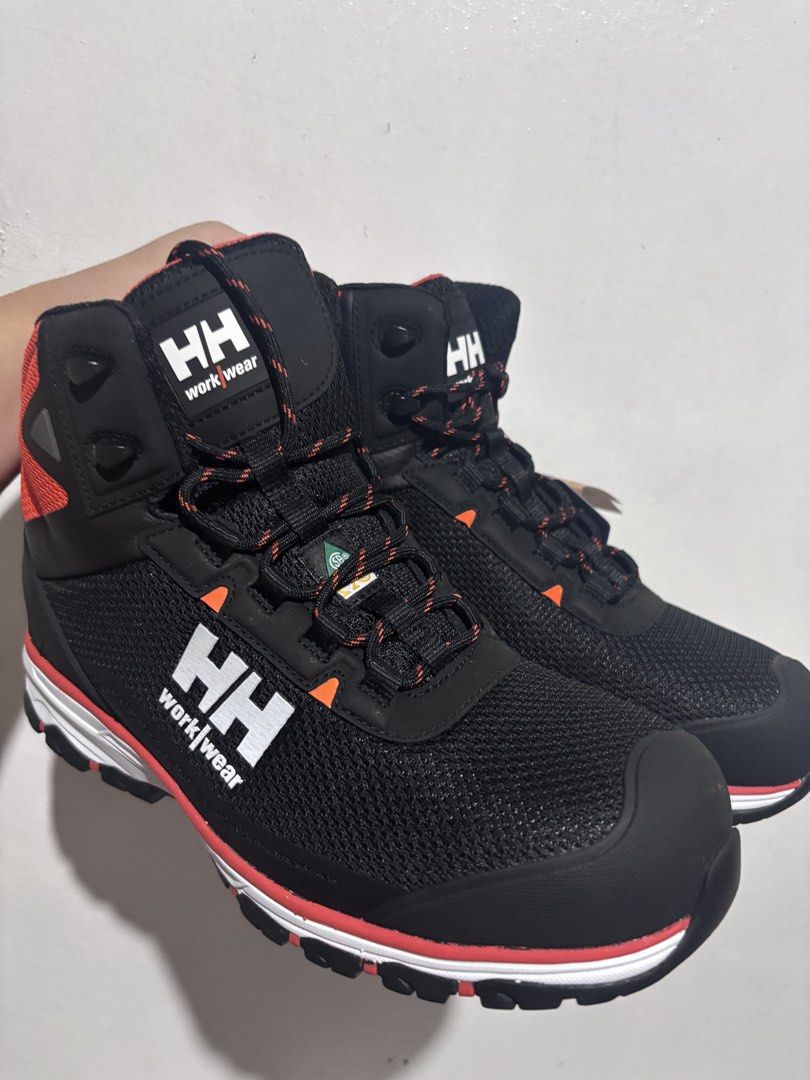 Helly Hansen Workwear Safety Boots Black Orange Size 9 (Category: Boots) located in Manila. Submitted by shieshieee (Listing ID 1466563055, Image 1). Description: - Brand: Helly Hansen - Style: High-top workwear boots - Color: Black and orange - Size: US 9 - Condition: Brand new, never worn, pristine condition with original tags still attached - Features: Durable mesh and protective toe cap .