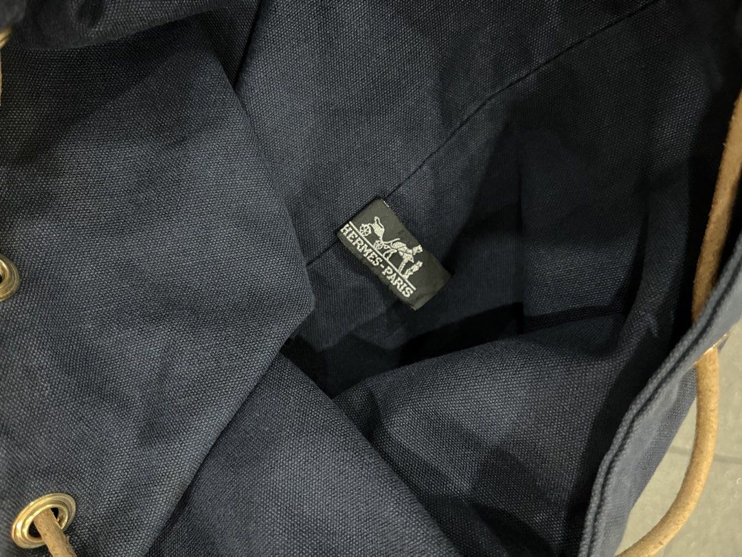 Hermes (Category: Luxury Bags & Wallets) located in Pasay City. Submitted by trash_or_treasure.543 (Listing ID 1466444485, Image 3). Description: Vintage Hermes Polochon Mimile drawstring bag crafted from navy blue cotton canvas with a subtle "H" logo near base.