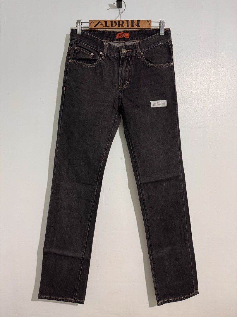 Hermès Black Denim Jeans (Category: Jeans) located in Cavite. Submitted by aldrindela40142 (Listing ID 1466484885, Image 2). Description: - Brand: Hermès - Item: Black denim jeans - Size: Labeled 30-31 (Length: 41 inches) - Details: Contrast orange stitching and branded silver-tone hardware - Branding: Orange interior waistband label, black leather back waist patch, and metal Hermès pocket tag - Condition: Excellent, 100% authentic - Shipping: Sh
