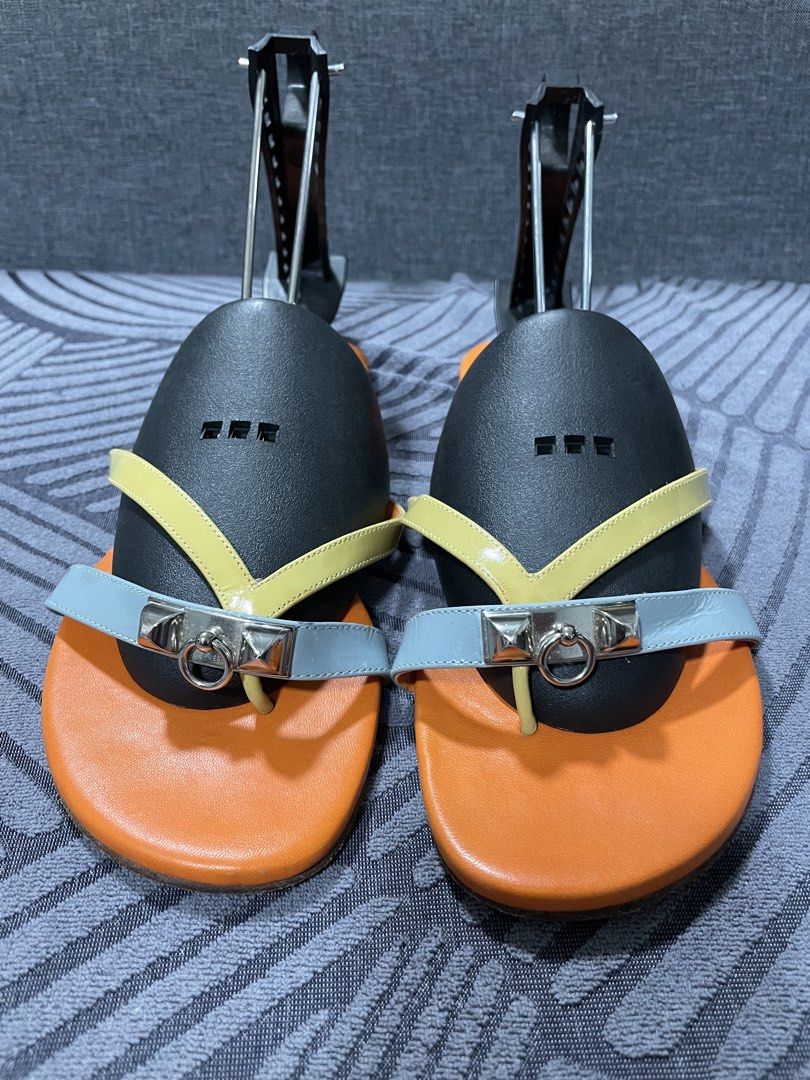 Hermès Corfu Sandals Size 35.5 Multi-color (Category: Sandals) located in Calapan. Submitted by lucasthrifts (Listing ID 1466561947, Image 2). Description: - Brand: Hermès - Model: Corfu Sandals - Size: 35.5 - Colorway: Multi-color (Orange footbed, yellow straps, light blue front strap) - Hardware: Silver-tone - Material: Leather upper and soles - Origin: Made in Spain - Style: Slip-on - Condition: Normal signs of wear on the soles; Hermes Paris 