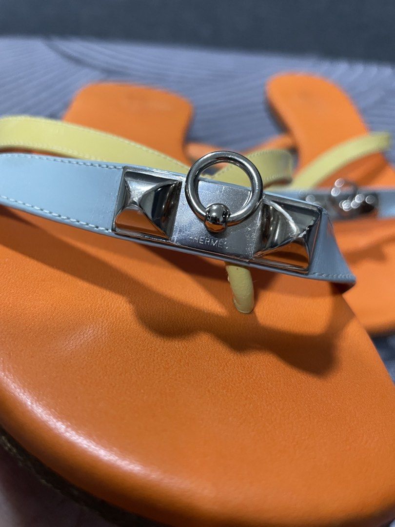 Hermès Corfu Sandals Size 35.5 Multi-color (Category: Sandals) located in Calapan. Submitted by lucasthrifts (Listing ID 1466561947, Image 3). Description: - Brand: Hermès - Model: Corfu Sandals - Size: 35.5 - Colorway: Multi-color (Orange footbed, yellow straps, light blue front strap) - Hardware: Silver-tone - Material: Leather upper and soles - Origin: Made in Spain - Style: Slip-on - Condition: Normal signs of wear on the soles; Hermes Paris 