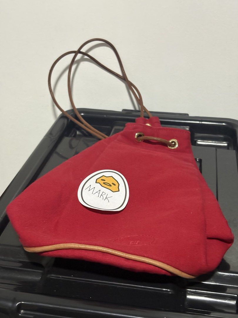 Hermès Paris Polochon Red Canvas Drawstring Bucket Bag (Category: Cross-body Bags) located in Cebu City. Submitted by xoxoxo888marco (Listing ID 1466533826, Image 1). Description: - Brand: Hermès Polochon Drawstring Bucket Bag - Color/Material: Striking red canvas with tan leather base trim and drawstring cords - Hardware: Gold-tone grommets with debossed front Hermès logo - Shape: Structured cylinder silhouette - Versatility: Can be worn over th