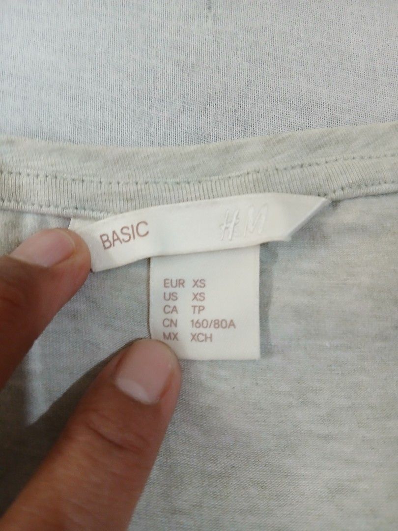 H&M Basic and Tribal Shirt (Category: Shirts) located in Manila. Submitted by relaxlang (Listing ID 1466400137, Image 3). Description: - Selling as set. Sizes xs to s - Brand: H&M Basic - Color: Light Grey - Size: XS - Material: 95% Cotton, 5% Elastane (Soft & stretchable) - Fit: Short sleeves, casual fit - Care: Machine washable - Condition: Excellent, perfect for everyday wear.