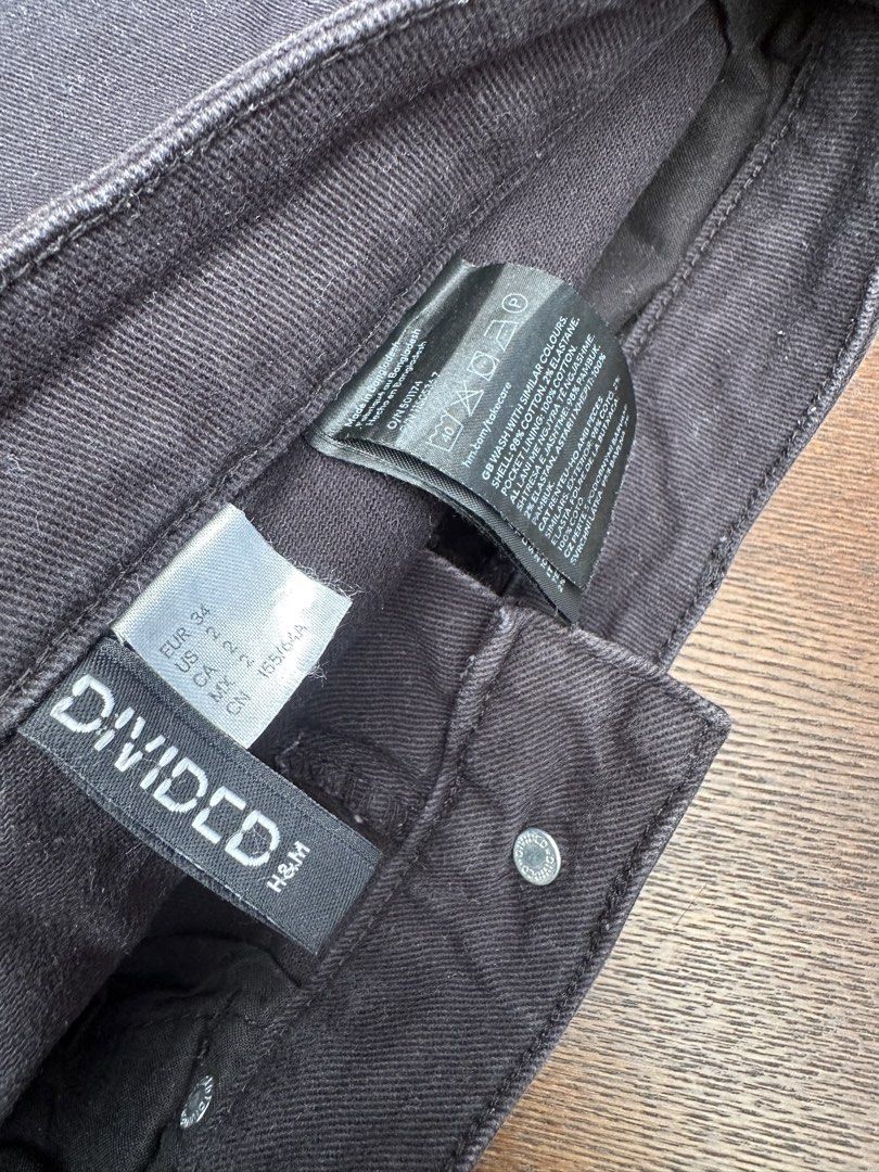 H&M Divided Black Denim Shorts (Category: Shorts) located in Bulacan. Submitted by thriftbagcollections (Listing ID 1466356216, Image 3). Description: - Brand: H&M Divided - Style: High-waisted denim shorts with raw frayed hem and classic 5-pocket design - Color: Solid black wash - Size: EUR 34 / US 2 - Material: 98% cotton, 2% elastane (Pocket lining: 100% cotton) - Closure: Button and zip fly - Condition: Excellent / Like new.