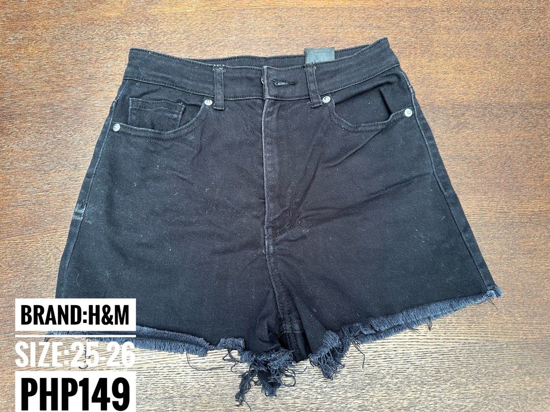 H&M Divided Black Denim Shorts (Category: Shorts) located in Bulacan. Submitted by thriftbagcollections (Listing ID 1466356216, Image 1). Description: - Brand: H&M Divided - Style: High-waisted denim shorts with raw frayed hem and classic 5-pocket design - Color: Solid black wash - Size: EUR 34 / US 2 - Material: 98% cotton, 2% elastane (Pocket lining: 100% cotton) - Closure: Button and zip fly - Condition: Excellent / Like new.
