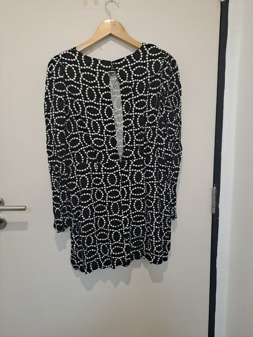 H&M DRESS (Category: Dresses) located in Manila. Submitted by joanbalde39643 (Listing ID 1466441255, Image 2). Description: This item is a black and white bead print open-back long sleeve mini dress by H&M. It features a round neckline with a keyhole back closure, long sleeves, and a distinctive geometric pattern composed of connected white dots mimicking strings of pearls or beads..