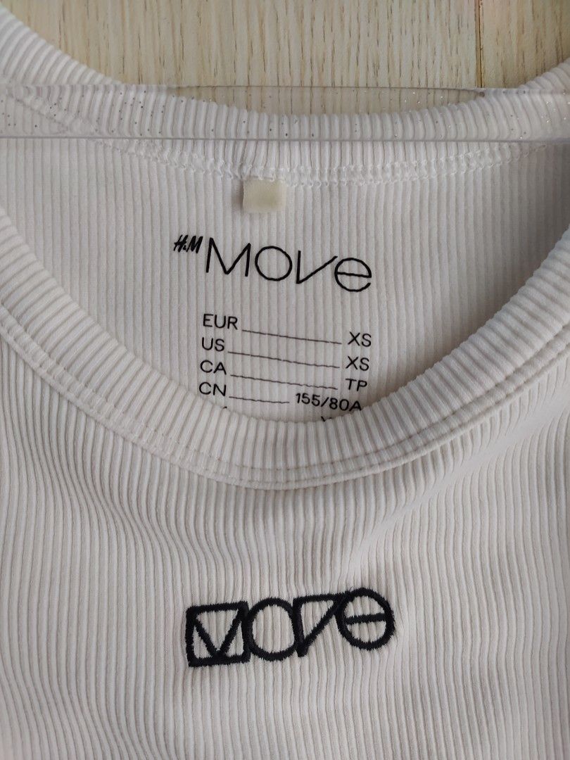H&M Move Tank Top (Category: Sleeveless) located in Bacoor. Submitted by lieze (Listing ID 1466435840, Image 2). Description: used only twice too small for me xs size white ribbed tank top.