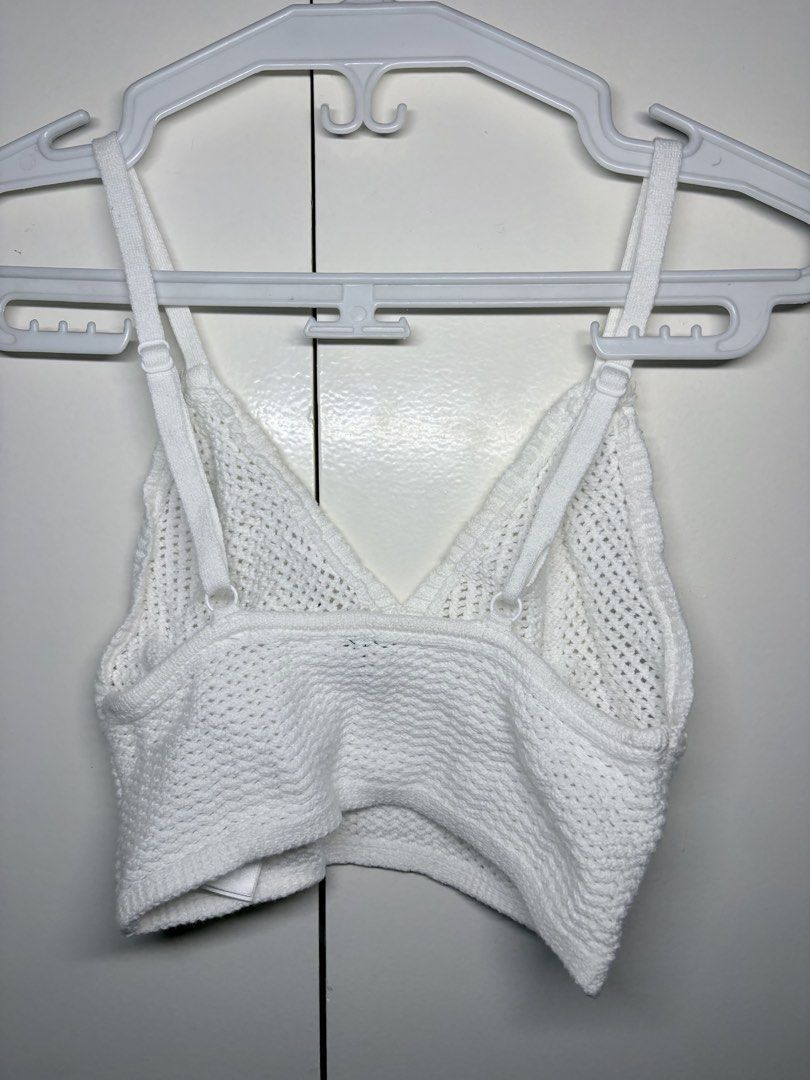White Crochet Bralette Crop Top (Category: Sleeveless) located in Paranaque City. Submitted by honeykkkk (Listing ID 1466487407, Image 2). Description: • Details: V-neckline, textured open-knit / crochet-style weave pattern, flattering bust seam details, wide elasticated lower band for support, and adjustable shoulder straps. Perfect as a summer beach bralette, festival top, or for layering under blazers and open shirts. • Condition: Excellent co