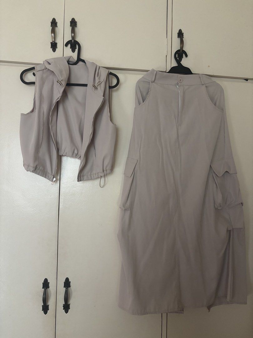 COORDS BUNDLE (Category: Sets or Coordinates) located in Manila. Submitted by jobithings (Listing ID 1466406202, Image 3). Description: - Matching greyish-beige two-piece set - Zip-up cropped hooded vest with adjustable drawstrings - Long utility skirt with trendy side cargo pockets - Lightweight and comfortable fabric - Versatile neutral tone that matches everything - Perfect for styling together or mixing and matching.