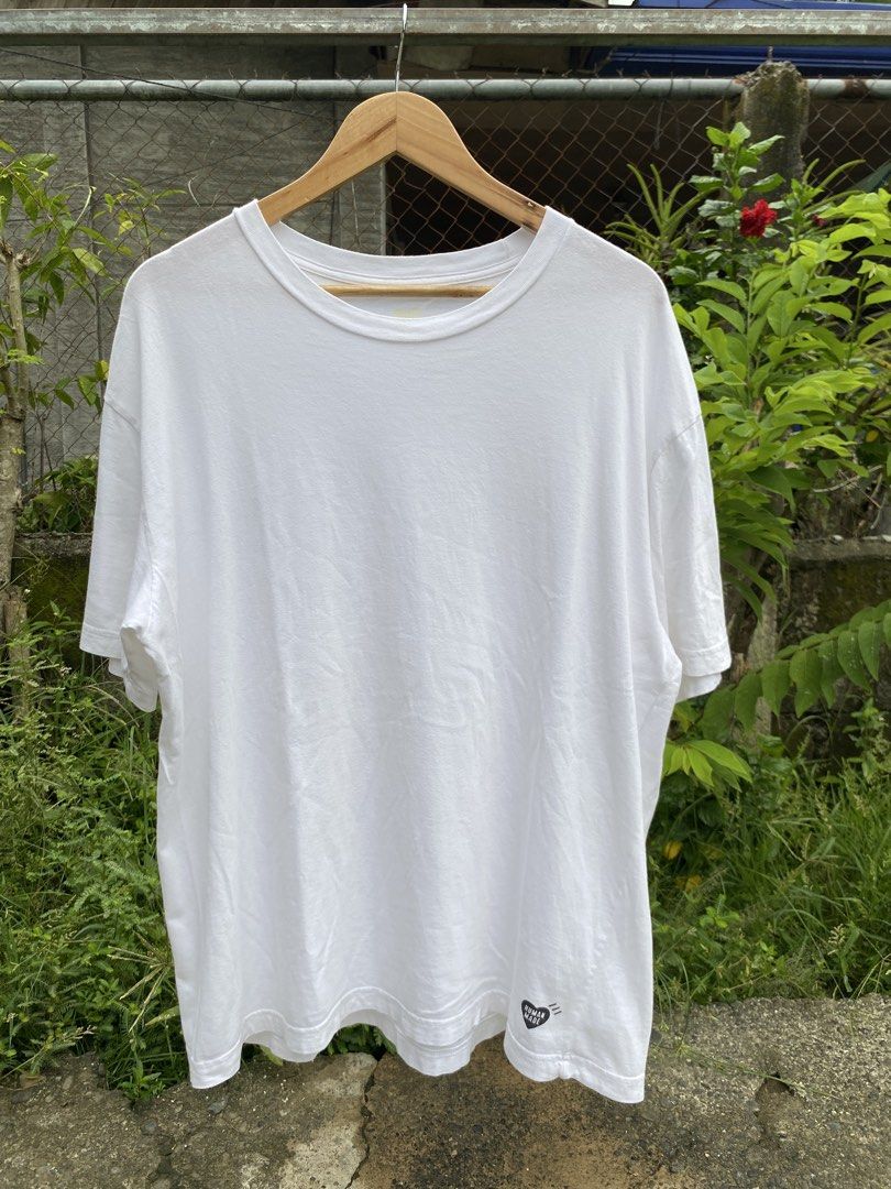 Human Made White Graphic Tee (Category: Tshirts & Polo Shirts ) located in Santo Tomas. Submitted by jomeldaniel999 (Listing ID 1466379044, Image 1). Description: Brand: Human Made White📌 Condition: Excellent Color rate:9.3/10 Size: XXL Dimes:24x28 Issue: Sign of usage White graphic tee from Human Made. Made of 100% cotton, super soft material. Features the signature black heart logo printed near the bottom hem and sleeve. Otsumo Co tag inside. 