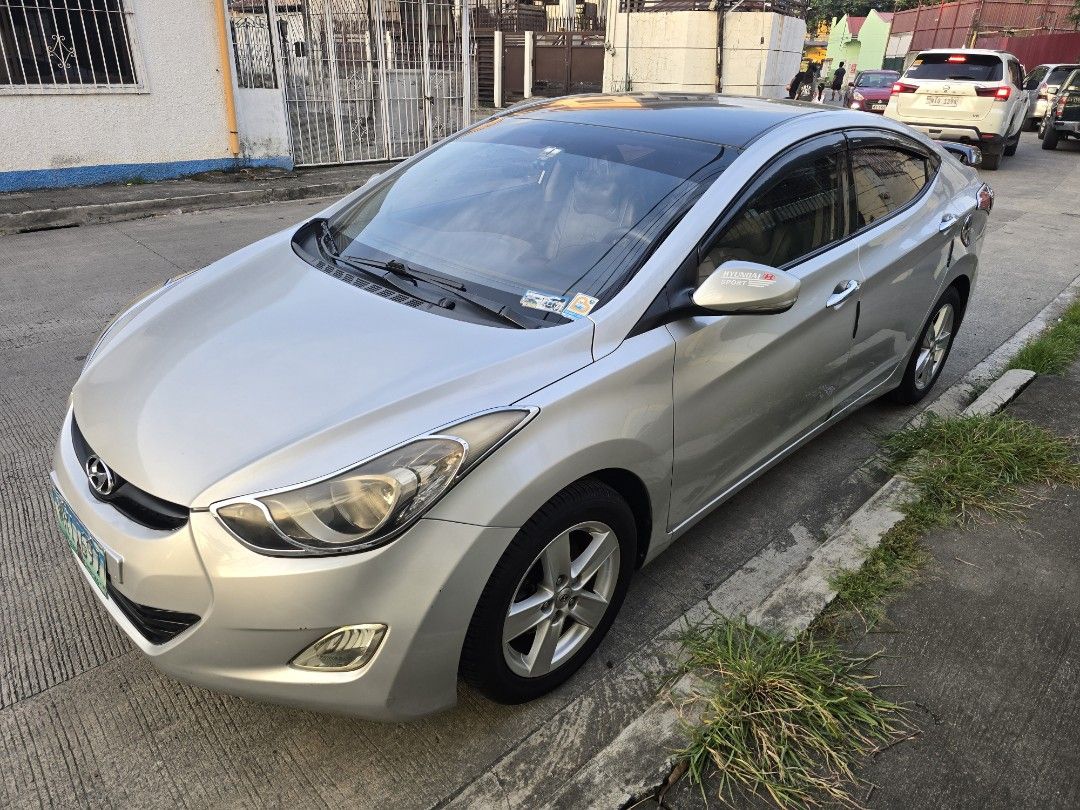 Hyundai Elantra 1.6 GL (A) (Category: Used Cars) located in Bacoor. Submitted by leogust (Listing ID 1466446659, Image 2). Description: FOR SALE (Negotiable ) (Test Drive allowed) HYUNDAI ELANTRA 2013 GL 1.6 Silver color Android head unit, Apple car play/ android auto Dash cam Reverse cam Fresh interior 120k ODO Issue: Minor scratches.