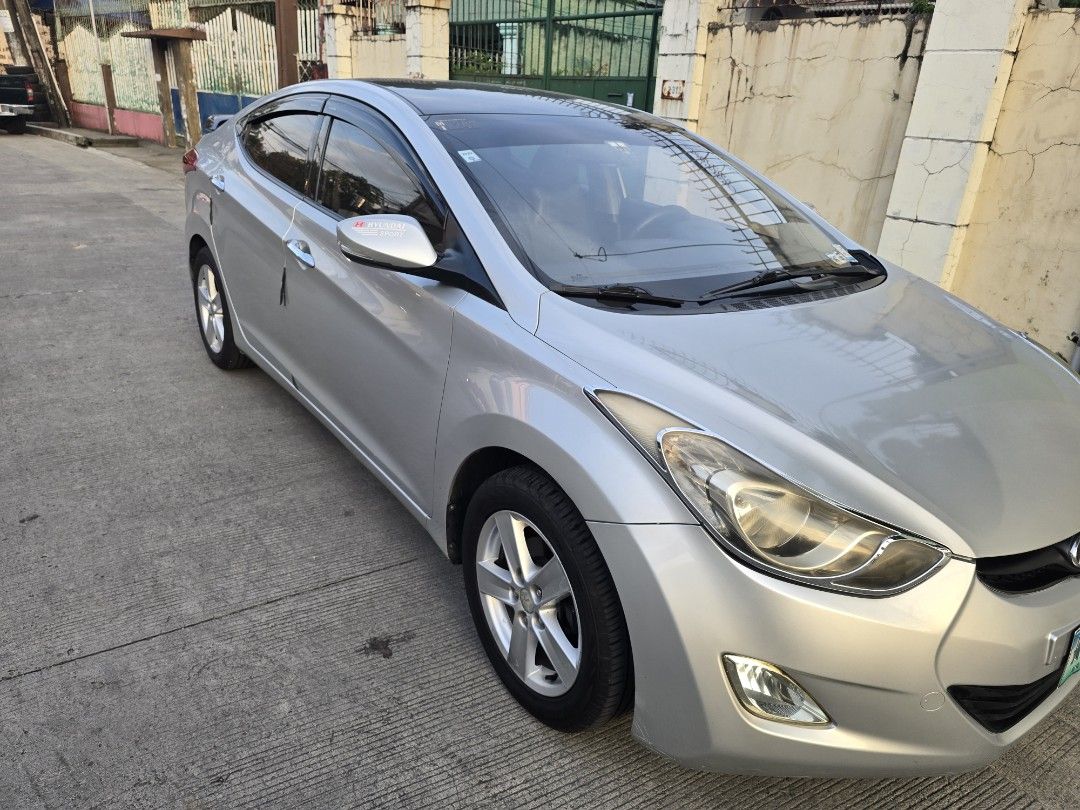 Hyundai Elantra 1.6 GL (A) (Category: Used Cars) located in Bacoor. Submitted by leogust (Listing ID 1466446659, Image 3). Description: FOR SALE (Negotiable ) (Test Drive allowed) HYUNDAI ELANTRA 2013 GL 1.6 Silver color Android head unit, Apple car play/ android auto Dash cam Reverse cam Fresh interior 120k ODO Issue: Minor scratches.
