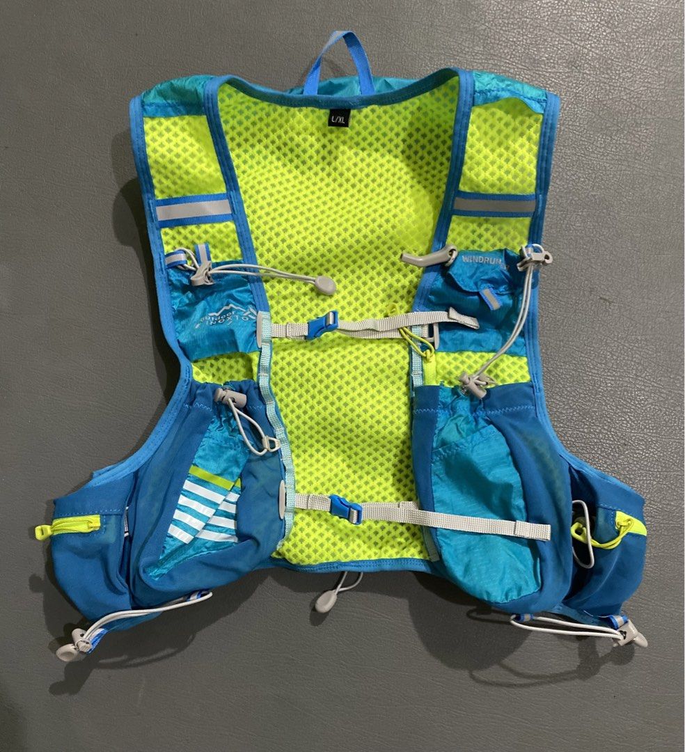 INOXTO Windrunner Hydration Vest Backpack (Category: Activewear) located in Pozorrubio. Submitted by izaykite2g (Listing ID 1466504440, Image 2). Description: - Brand: INOXTO Windrunner Hydration Vest Backpack - Color: Blue with neon yellow accents - Size: L/XL (tag attached at the collar) - Breathable mesh back panel for cooling - Convenient front pockets and zippered upper back compartment - Adjustable bungee cord chest straps for a secure fit 
