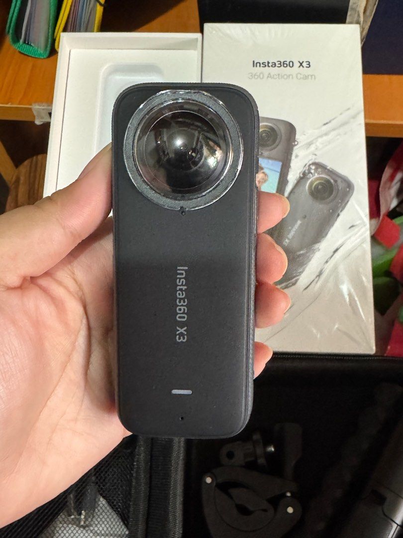 Insta360 X3 360 Action Cam with Accessories (Category: Cameras) located in Makati City. Submitted by yohanzen (Listing ID 1466515283, Image 3). Description: ✨✨ WITH SD CARD✨✨ Insta360 X3 360 action camera in black. Includes the original retail box, carrying case, two selfie sticks, a clamp mount, and a protective silicone case. Dual fisheye lenses, touchscreen interface, and side control buttons. Ready to shoot out of the box. 📱✨ GADGETS FOR SAL