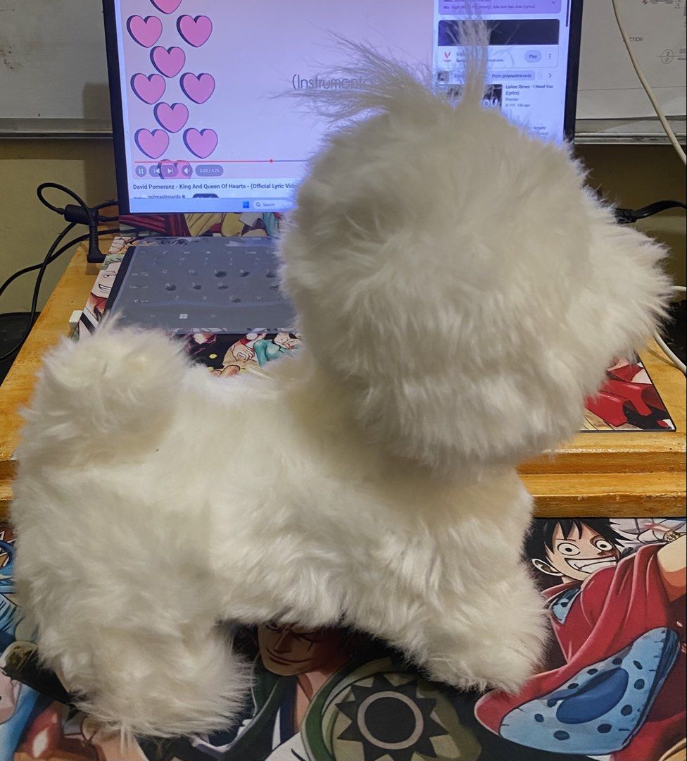 Interactive White Puppy Dog Electronic Plush Toy (Category: Plushies & Soft Toys) located in Baguio. Submitted by thrift_bonita (Listing ID 1466494346, Image 2). Description: - Adorable fluffy white toy puppy with a soft coat - Features a cute black button nose and a fluffy tail - Stands firmly on its own - Electronic functions powered by batteries (compartment underneath, date stamp 2022.09) - Clean, well-maintained condition -not tesdted if wor