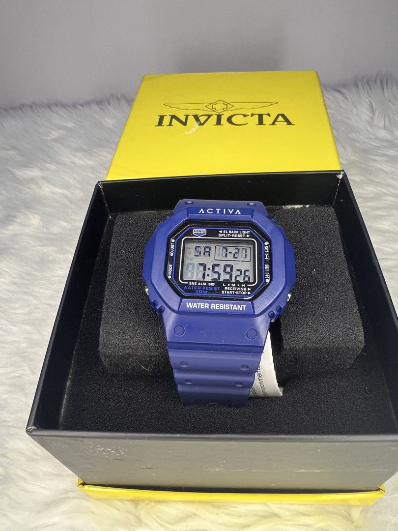 Invicta Activa Digital Watch Blue With Box (Category: Men's Watches) located in Quezon City. Submitted by gigisantos (Listing ID 1466506765, Image 1). Description: - Brand: Invicta Activa - Color: Bright blue resin with flexible rubber strap - Display: Square digital showing time, day, and date - Functions: Alarm, chronograph, and backlight - Water Resistance: Up to 30 meters - Inclusions: Original yellow Invicta presentation box and paper tag - 