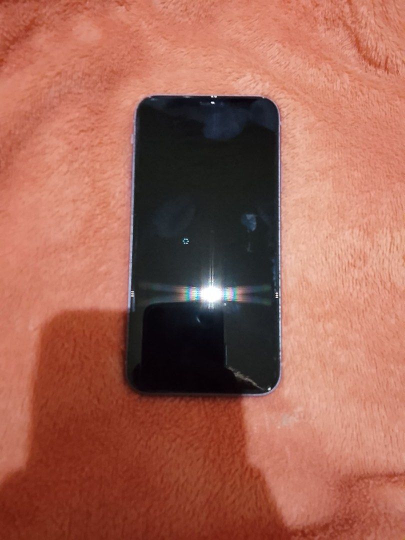 Iphone 11 128GB (Negotiable) (Category: iPhone 11 Series) located in Tanza. Submitted by gwen1905 (Listing ID 1466447445, Image 2). Description: * 128GB * 75% battery health * Face ID ✅ * Cameras/front + rear ✅ * Speakers/mic ✅ * Wi-Fi/Bluetooth/AirDrop ✅ * Charging port ✅ * Buttons ✅ * SIM/openline status * True Tone ✅ * iCloud/Find My can be removed/reset ✅ * Screen has a visible line * Screen slightly lifts from frame; taped down * No charger 
