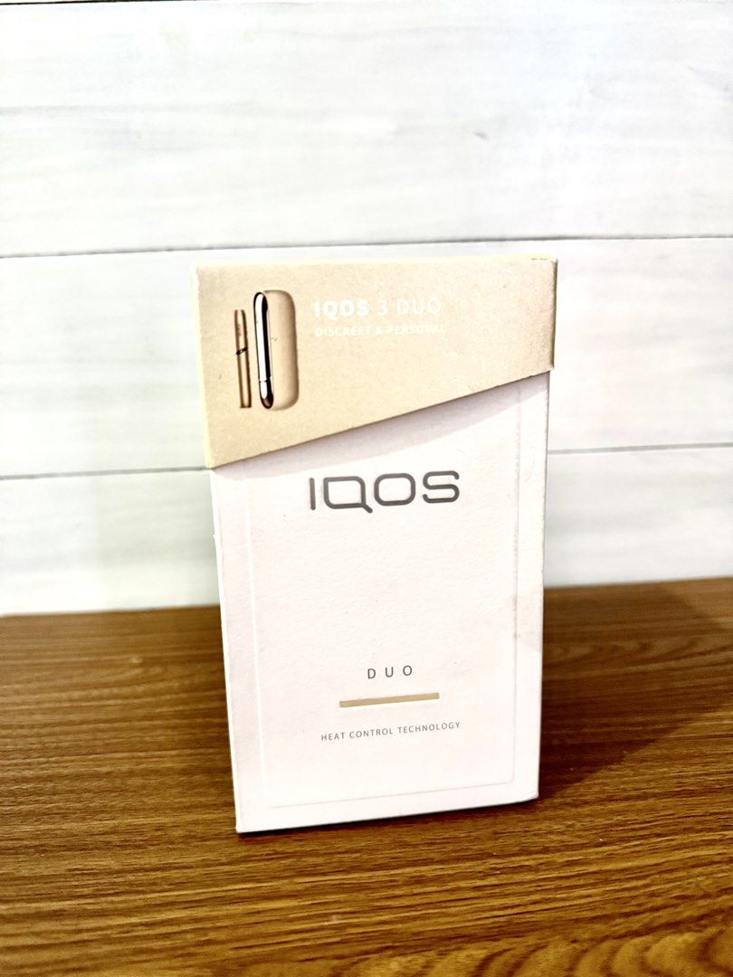 IQOS 3 Duo Heat Control Technology Kit (Category: Earphones) located in Quezon City. Submitted by appplebananna (Listing ID 1466478275, Image 1). Description: IQOS 3 Duo heat control system kit box. Includes holder, pocket charger, AC power adaptor, USB type C cable, cleaning tool, and 10 cleaning sticks. Made in Malaysia, Philip Morris Products S.A. Bluetooth enabled device. Box shows complete system specifications and serial details on the back
