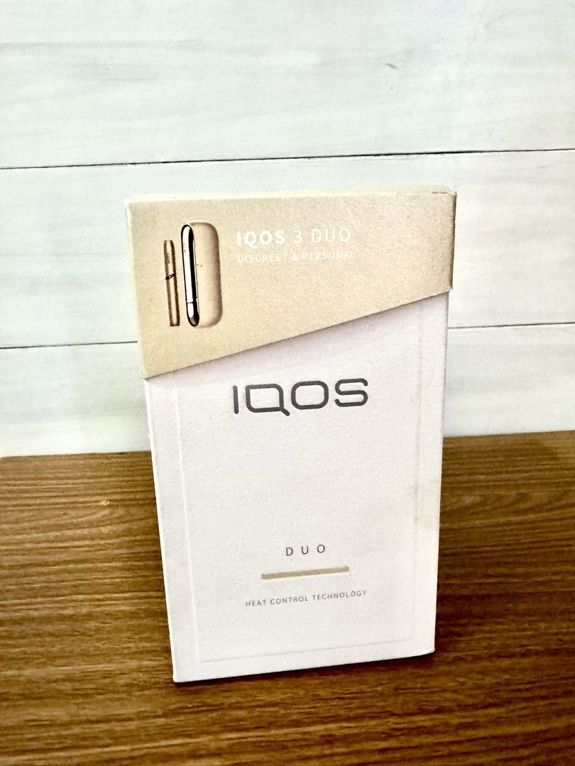 IQOS 3 Duo Heat Control Technology Kit (Category: Earphones) located in Quezon City. Submitted by appplebananna (Listing ID 1466478275, Image 2). Description: IQOS 3 Duo heat control system kit box. Includes holder, pocket charger, AC power adaptor, USB type C cable, cleaning tool, and 10 cleaning sticks. Made in Malaysia, Philip Morris Products S.A. Bluetooth enabled device. Box shows complete system specifications and serial details on the back