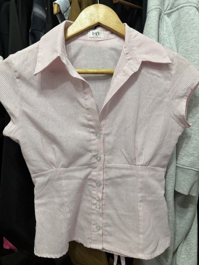 Isa The Label Pink Striped Button-Up Blouse (Category: Blouses) located in Pasay City. Submitted by whot4o (Listing ID 1466502331, Image 1). Description: - Brand: Isa The Label - Design: Pink and white striped short-sleeve button-up - Details: Classic collar, fitted waist silhouette, front button closure - Fabric: Lightweight with a nice textured weave - Condition: Excellent / Like new .