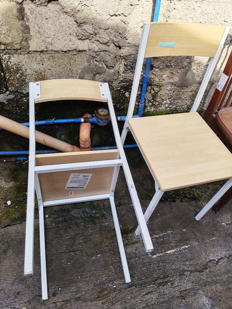 Japan surplus Partner Chair (Category: Chairs) located in Manila. Submitted by aks_japansurplus30 (Listing ID 1466519469, Image 2). Description: - Item: Pair of IKEA BUSLÄTT chairs - Design: Minimalist white metal frame with light pine-colored seat and backrest - Condition: Brand new, never assembled or used (instruction sticker still attached), zero scratches - Features: Sturdy steel legs equipped with protective floor caps - Ideal For: Dining a