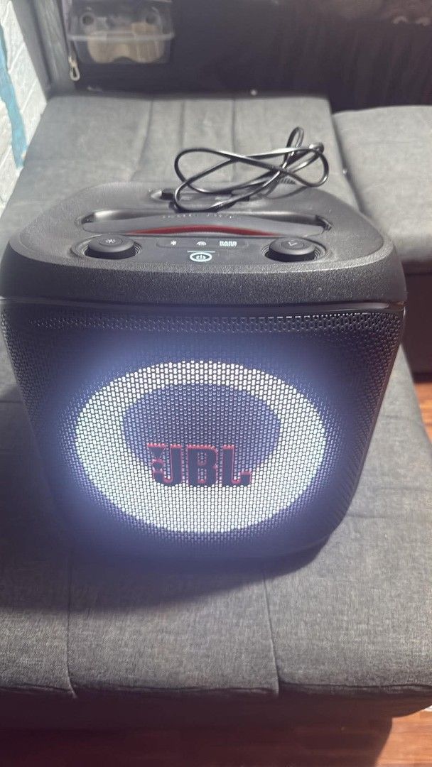 JBL PartyBox Encore Essential Portable Bluetooth Speaker with Microphones (Category: Soundbars, Speakers & Amplifiers) located in Rizal. Submitted by janeyca07 (Listing ID 1466368917, Image 3). Description: - Authentic JBL PartyBox portable speaker in sleek black - Powerful sound output with a vibrant built-in light ring on the front grille - Includes two wireless microphones that store securely in slots on the back panel - Convenient top control