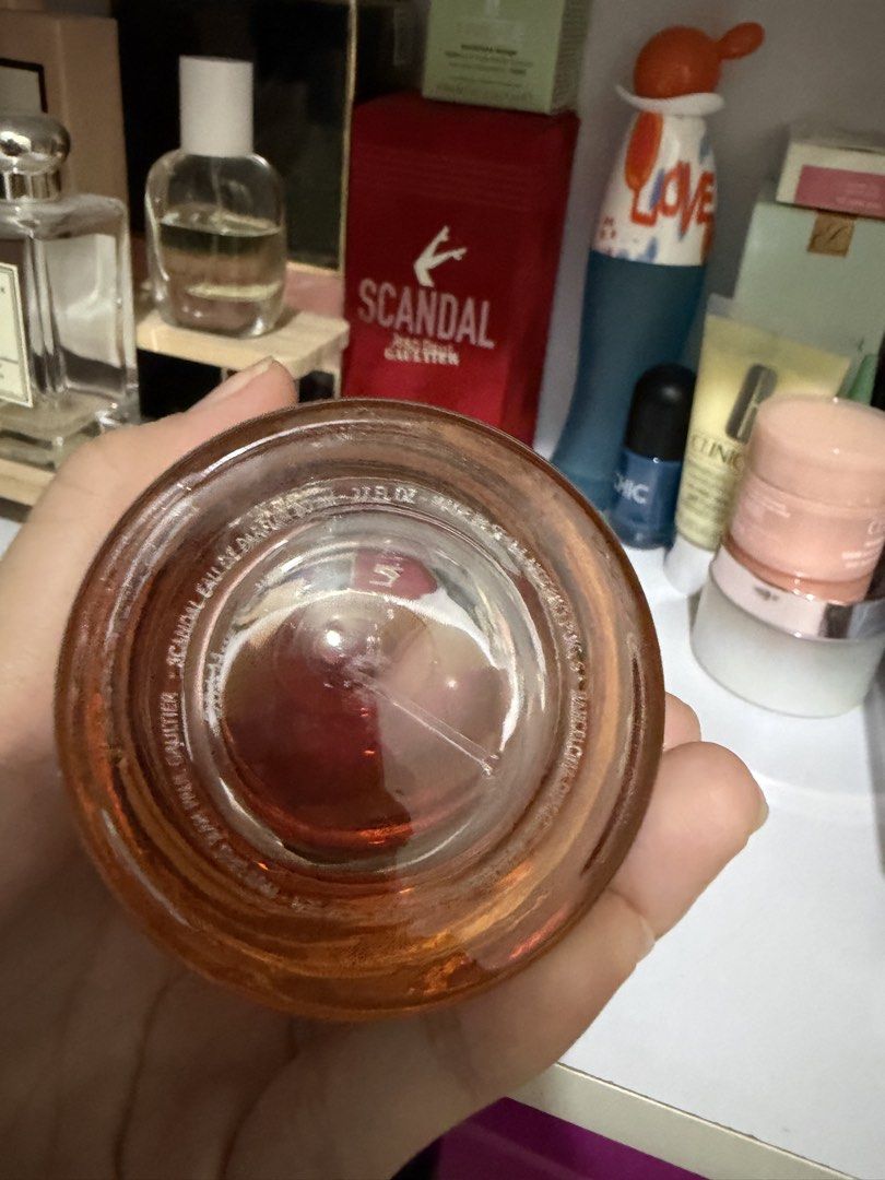 Jean Paul Gaultier Scandal EDP 80ml (Category: Fragrance & Deodorants) located in Taguig. Submitted by _abbyscloset_ (Listing ID 1466561987, Image 2). Description: - Authentic Jean Paul Gaultier Scandal Eau de Parfum - Generous 80ml bottle size - Iconic and distinctive gold legs cap design - Rich amber juice visible through clear glass - Clear batch info and text molded on the heavy base - Properly stored away from direct sunlight in a cool, dark