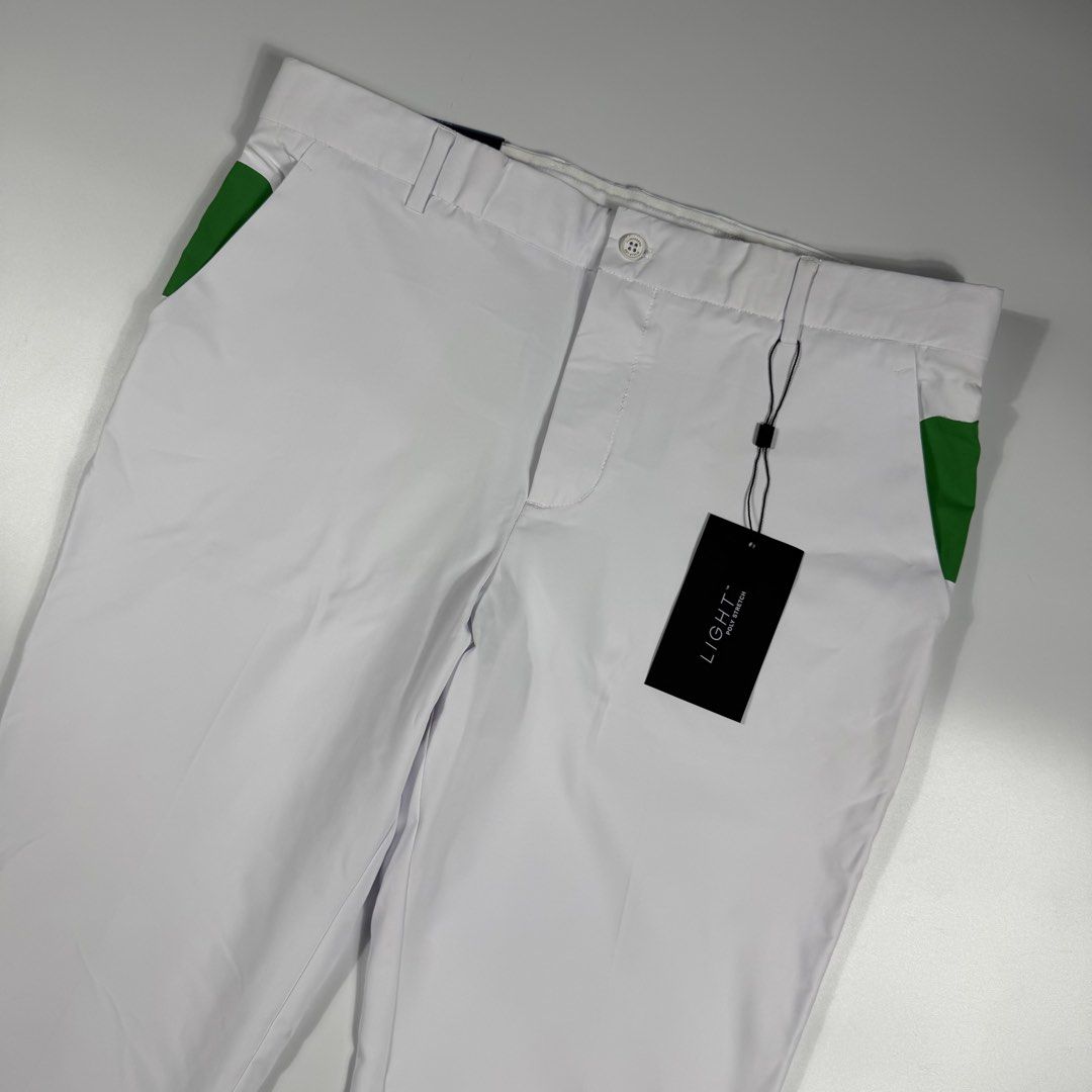 j.lindeberg Johan Light Poly Stretch Golf Pants White (Category: Trousers) located in Bacolod City. Submitted by freshstuff13 (Listing ID 1466392728, Image 3). Description: - Brand: J.Lindeberg - Model: Johan Golf Trousers - Size: 34x32 - Color: White with green contrast panels - Condition: Brand new with original tags attached, never worn - Material: Lightweight poly stretch fabric for on-course mobility - Features: Button closure, zipped fly, s
