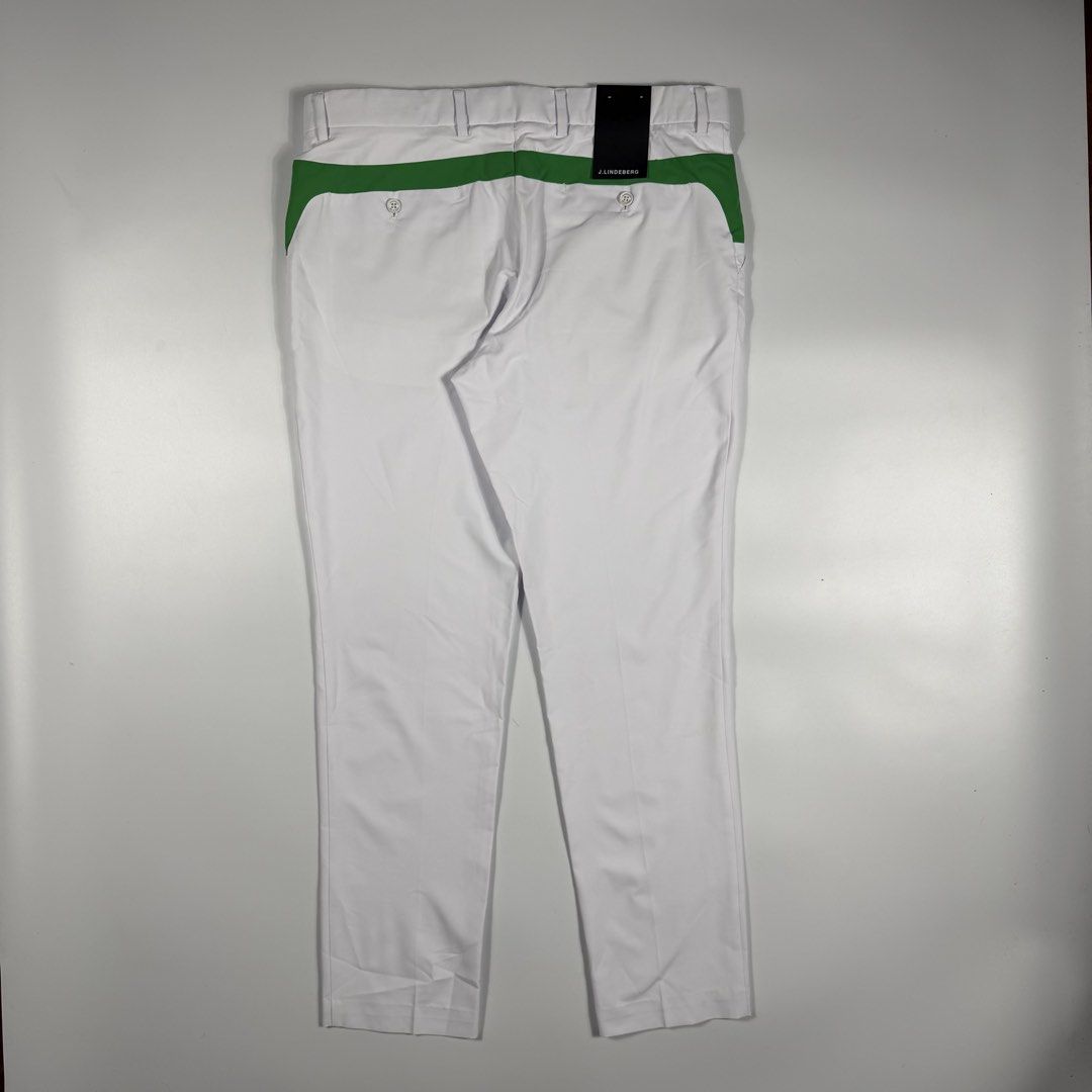 j.lindeberg Johan Light Poly Stretch Golf Pants White (Category: Trousers) located in Bacolod City. Submitted by freshstuff13 (Listing ID 1466392728, Image 2). Description: - Brand: J.Lindeberg - Model: Johan Golf Trousers - Size: 34x32 - Color: White with green contrast panels - Condition: Brand new with original tags attached, never worn - Material: Lightweight poly stretch fabric for on-course mobility - Features: Button closure, zipped fly, s