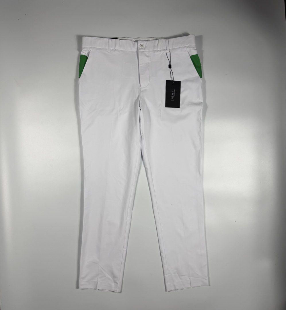 j.lindeberg Johan Light Poly Stretch Golf Pants White (Category: Trousers) located in Bacolod City. Submitted by freshstuff13 (Listing ID 1466392728, Image 1). Description: - Brand: J.Lindeberg - Model: Johan Golf Trousers - Size: 34x32 - Color: White with green contrast panels - Condition: Brand new with original tags attached, never worn - Material: Lightweight poly stretch fabric for on-course mobility - Features: Button closure, zipped fly, s