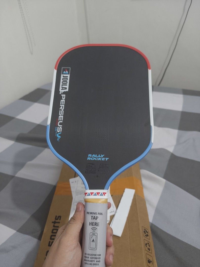 Joola Perseus Pro 16mm Pickleball Paddle (Category: Racket and Ball Sports) located in Manila. Submitted by torresj.0602 (Listing ID 1466550698, Image 2). Description: - Brand: OEM Joola Perseus Pro 16mm Pickleball Paddle - Condition: Brand new and unused - Design: Sleek black surface with striking blue and red edge guard - Handle: Still wrapped in protective plastic with the official warranty sticker intact - Inclusion: Original box included - P