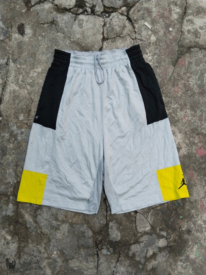 Jordan Bankroll Version 3 (Category: Shorts) located in Tabaco. Submitted by skycat_29 (Listing ID 1466383887, Image 1). Description: - Brand: Jordan - Size: Medium (Style code: 729413-012, SU15) - Color: Grey, black, and yellow colorblock - Material: Breathable mesh polyester, machine washable - Features: Elastic waistband with adjustable drawstring - Details: Iconic Jumpman logo on the yellow hem and small side tag.