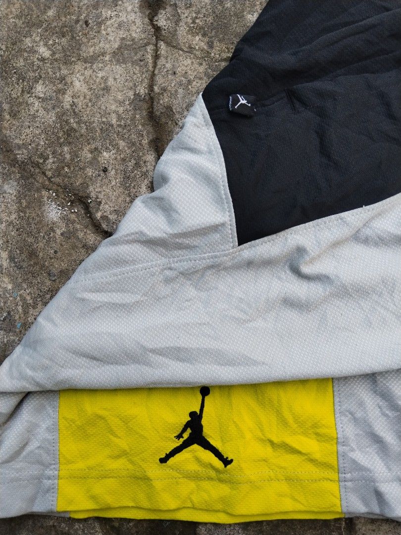 Jordan Bankroll Version 3 (Category: Shorts) located in Tabaco. Submitted by skycat_29 (Listing ID 1466383887, Image 3). Description: - Brand: Jordan - Size: Medium (Style code: 729413-012, SU15) - Color: Grey, black, and yellow colorblock - Material: Breathable mesh polyester, machine washable - Features: Elastic waistband with adjustable drawstring - Details: Iconic Jumpman logo on the yellow hem and small side tag.