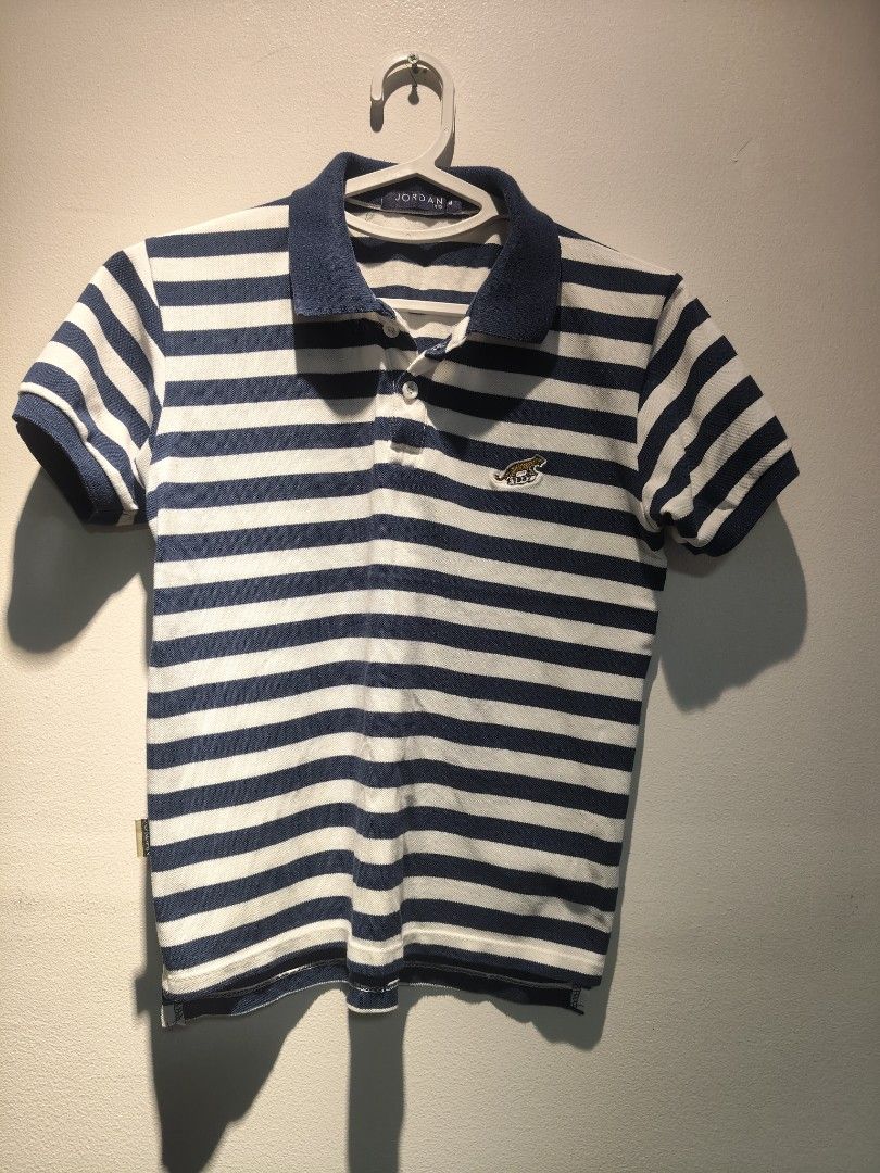 Jordan Kid Boys Polo Shirt M (Category: Babies & Kids Fashion) located in Pasig City. Submitted by furmom06 (Listing ID 1466352946, Image 1). Description: W - 17" L- 20" Navy Blue and White Stripes.