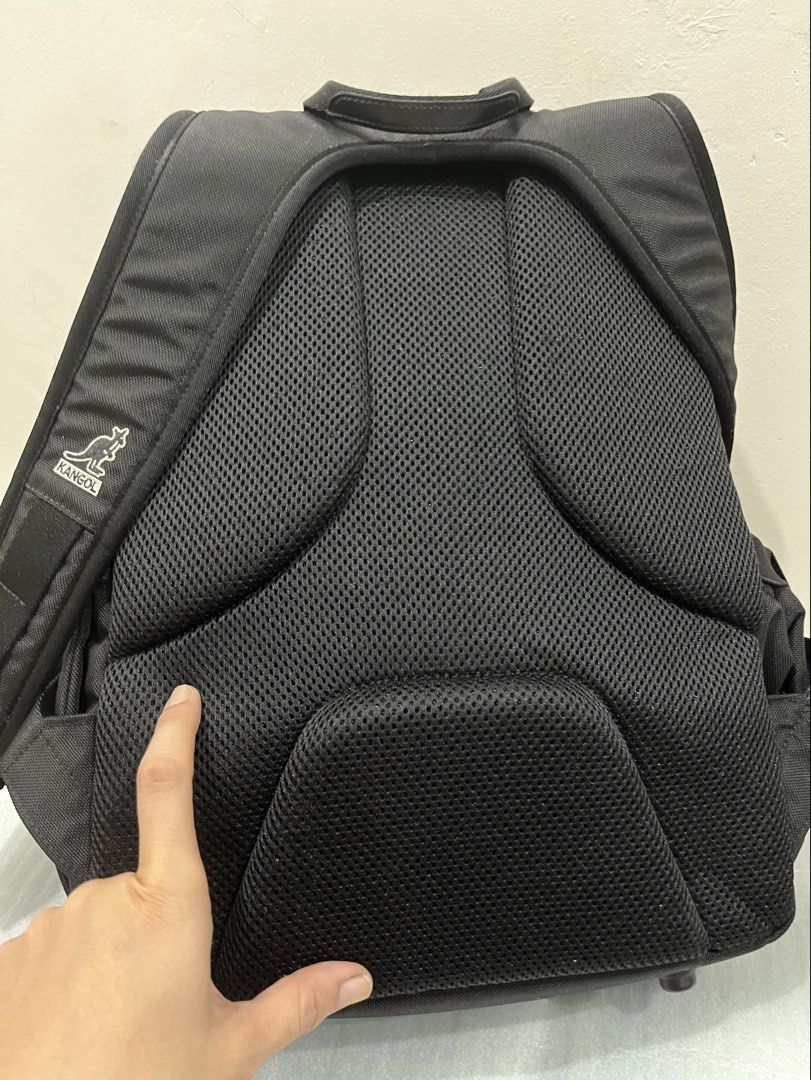 Kangol Black Backpack Bag (Category: Backpacks) located in Talisay. Submitted by cherylu (Listing ID 1466561817, Image 2). Description: - Brand: Kangol - Color: Classic Black with large front kangaroo logo - Comfort: Padded mesh back panel for all-day wear - Storage: Spacious main compartment for school or work essentials - Interior Features: Built-in name/school tag slot and a secure zippered pocket with brand tag - Quality: Durable exterior fab
