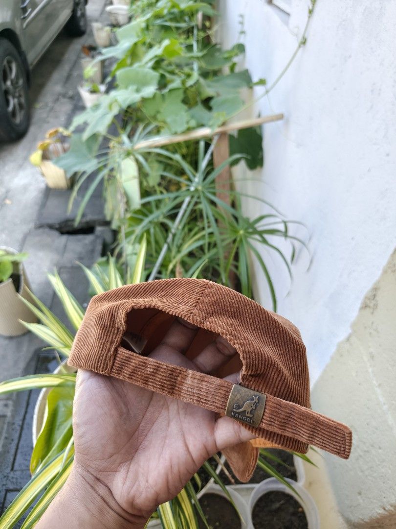 Kangol Corduroy Baseball Cap Choco Brown (Category: Caps & Hats) located in Binan City. Submitted by makinpeso0622 (Listing ID 1466372225, Image 2). Description: - Brand: Kangol - Style: Corduroy baseball cap (unstructured) - Color: Rich brown - Details: Embroidered kangaroo logo on front, adjustable strap with branded metal clasp - Condition: Minor wear on the inner sweatband from previous use, otherwise in great shape - Super comfortable and ve