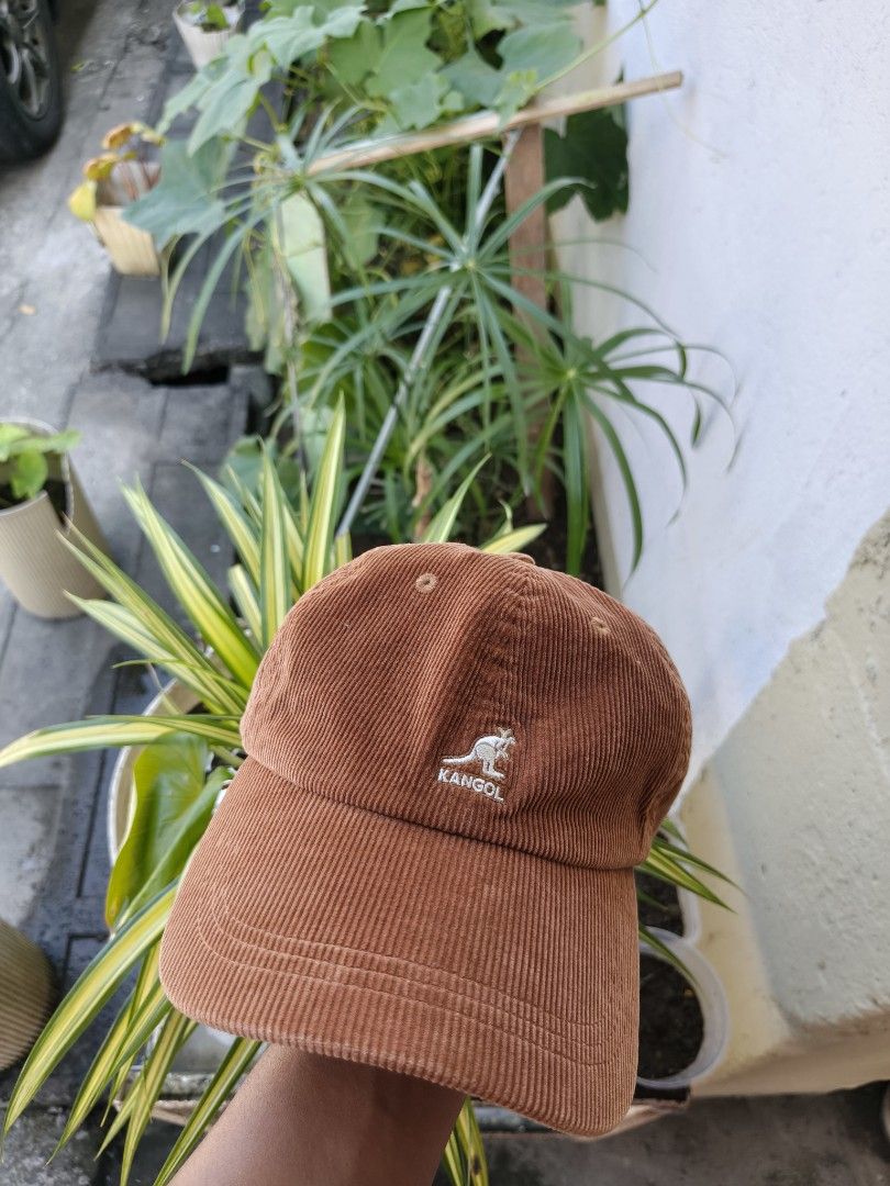 Kangol Corduroy Baseball Cap Choco Brown (Category: Caps & Hats) located in Binan City. Submitted by makinpeso0622 (Listing ID 1466372225, Image 1). Description: - Brand: Kangol - Style: Corduroy baseball cap (unstructured) - Color: Rich brown - Details: Embroidered kangaroo logo on front, adjustable strap with branded metal clasp - Condition: Minor wear on the inner sweatband from previous use, otherwise in great shape - Super comfortable and ve
