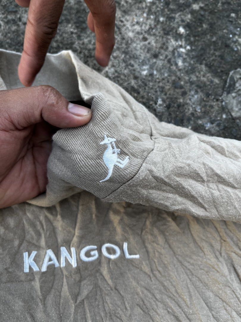 Kangol Mock Neck Long Sleeve Beige Top (Category: Longsleeves) located in Calabanga. Submitted by jijithriftcamarinessur (Listing ID 1466337717, Image 3). Description: - Brand: Kangol - Color: Beige - Size/Fit: Relaxed fit basic layer - Material: 100% cotton - Design: Mock neck collar with small embroidered kangaroo logo near collar and left sleeve, plus large white Kangol chest lettering - Details: Style number 9473-1559, made in China.