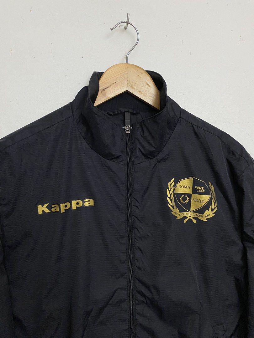 Kappa AS Roma Black Gold Track Jacket Large (Category: Coats, Jackets and Outerwear) located in Cagayan de Oro. Submitted by stllht (Listing ID 1466450376, Image 2). Description: - Brand: Kappa - Color: Black with gold lettering and crest - Size: Large -Dimes: 22x25 - Details: Sleeve logos, full zip front, ribbed collar, cuffs, and hem - Lining: Comfortable inner mesh - Condition: Clean overall.