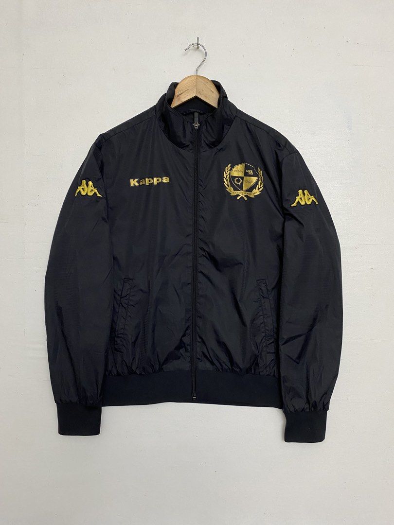 Kappa AS Roma Black Gold Track Jacket Large (Category: Coats, Jackets and Outerwear) located in Cagayan de Oro. Submitted by stllht (Listing ID 1466450376, Image 1). Description: - Brand: Kappa - Color: Black with gold lettering and crest - Size: Large -Dimes: 22x25 - Details: Sleeve logos, full zip front, ribbed collar, cuffs, and hem - Lining: Comfortable inner mesh - Condition: Clean overall.