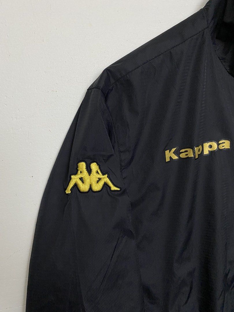 Kappa AS Roma Black Gold Track Jacket Large (Category: Coats, Jackets and Outerwear) located in Cagayan de Oro. Submitted by stllht (Listing ID 1466450376, Image 3). Description: - Brand: Kappa - Color: Black with gold lettering and crest - Size: Large -Dimes: 22x25 - Details: Sleeve logos, full zip front, ribbed collar, cuffs, and hem - Lining: Comfortable inner mesh - Condition: Clean overall.